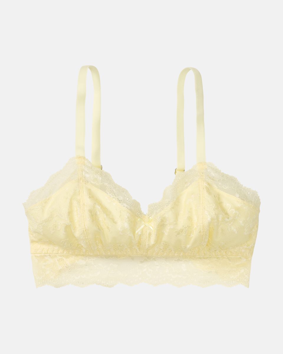 Bralette in zitrone aus der Serie Lacy, flach auf einer Oberfläche liegend.
