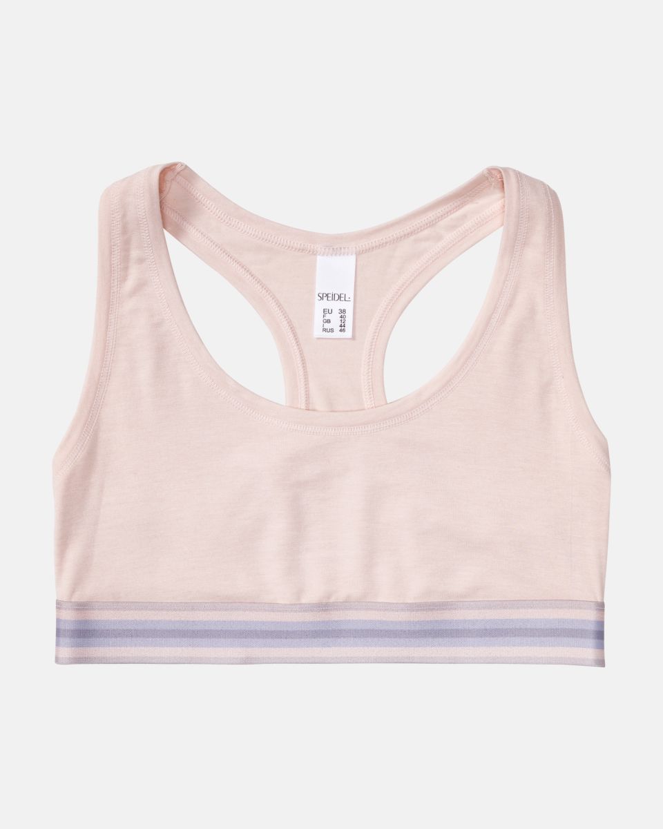 Bustier in lychee mélé aus der Serie Ruby, flach auf einer Oberfläche liegend.