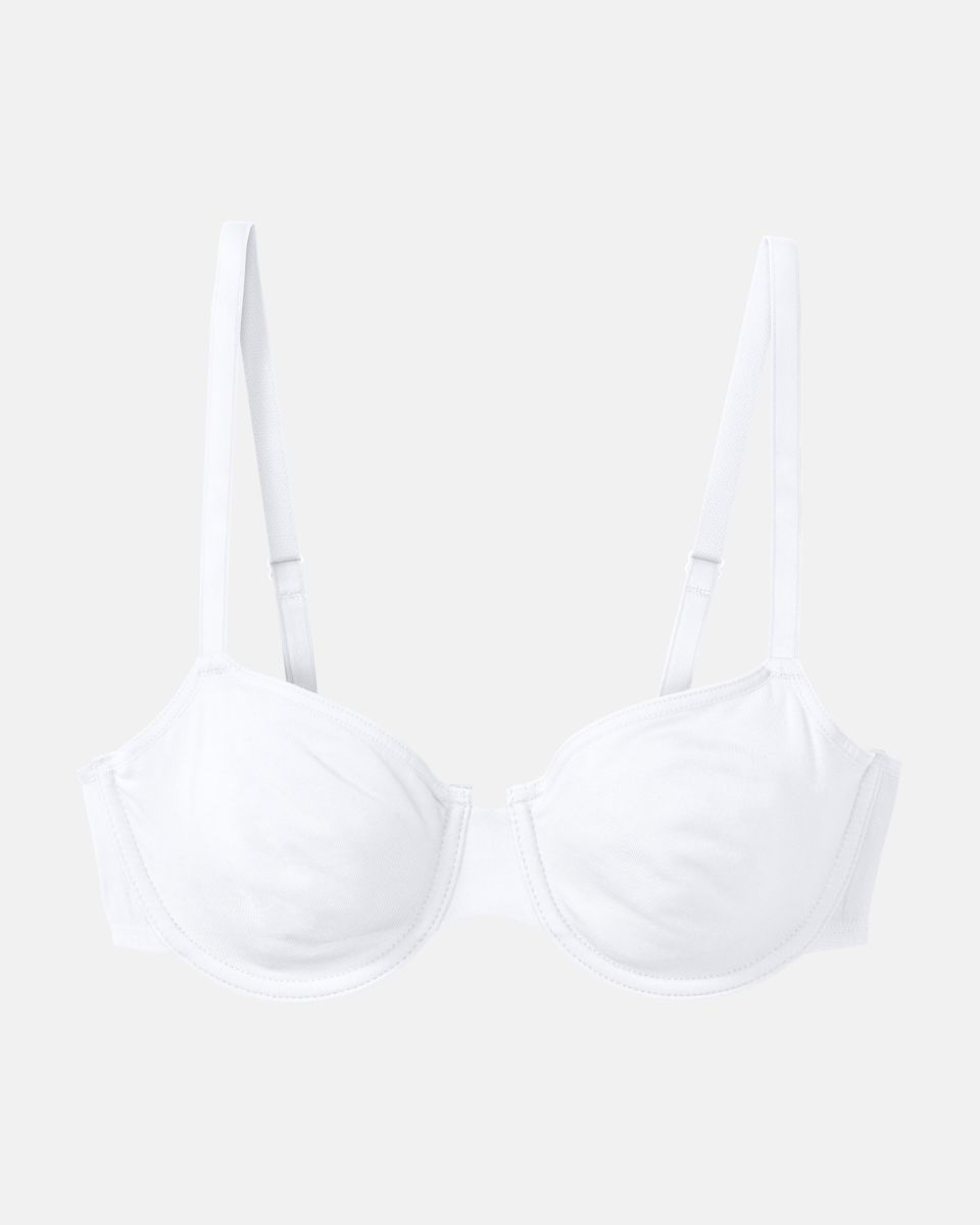 Bügel BH in weiß aus der Serie Softfeeling, flach auf einer Oberfläche liegend.