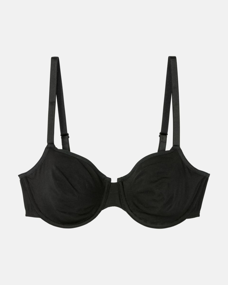 Bügel BH in schwarz aus der Serie Softfeeling, flach auf einer Oberfläche liegend.