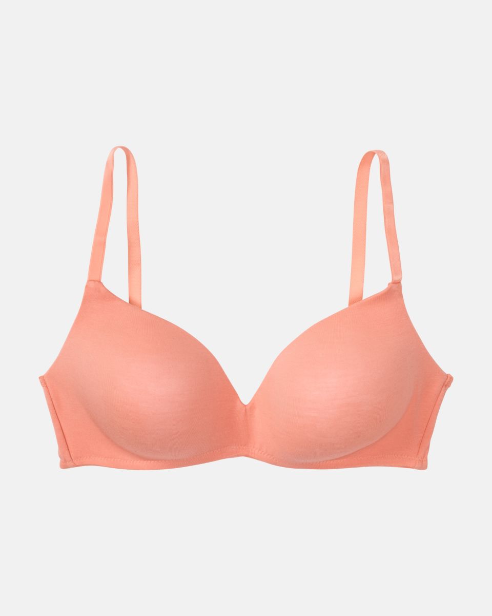 Schalen BH non wired in melone aus der Serie Softfeeling, flach auf einer Oberfläche liegend.