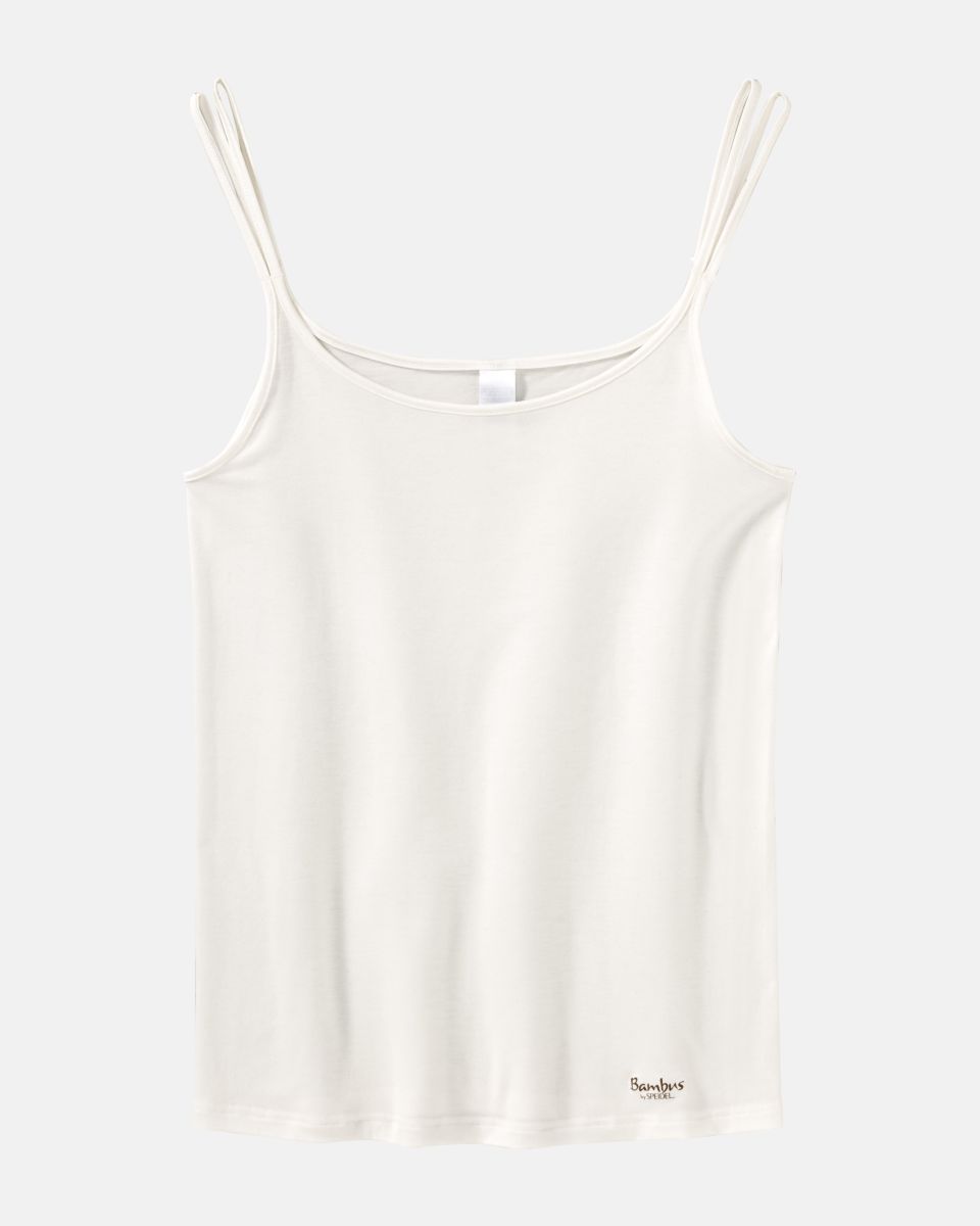 Hemd in elfenbein aus der Serie Bambus, flach auf einer Oberfläche liegend.