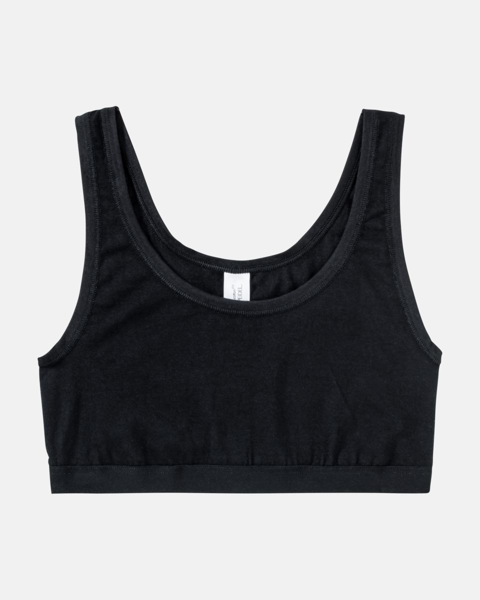 Achselbustier in schwarz aus der Serie Bio Cotton plus, flach auf einer Oberfläche liegend.